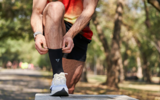runner putting on two socks