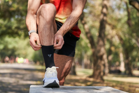 runner putting on two socks