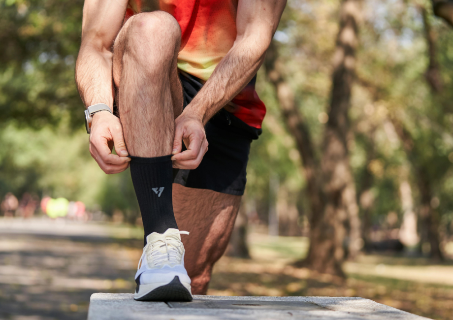 runner putting on two socks