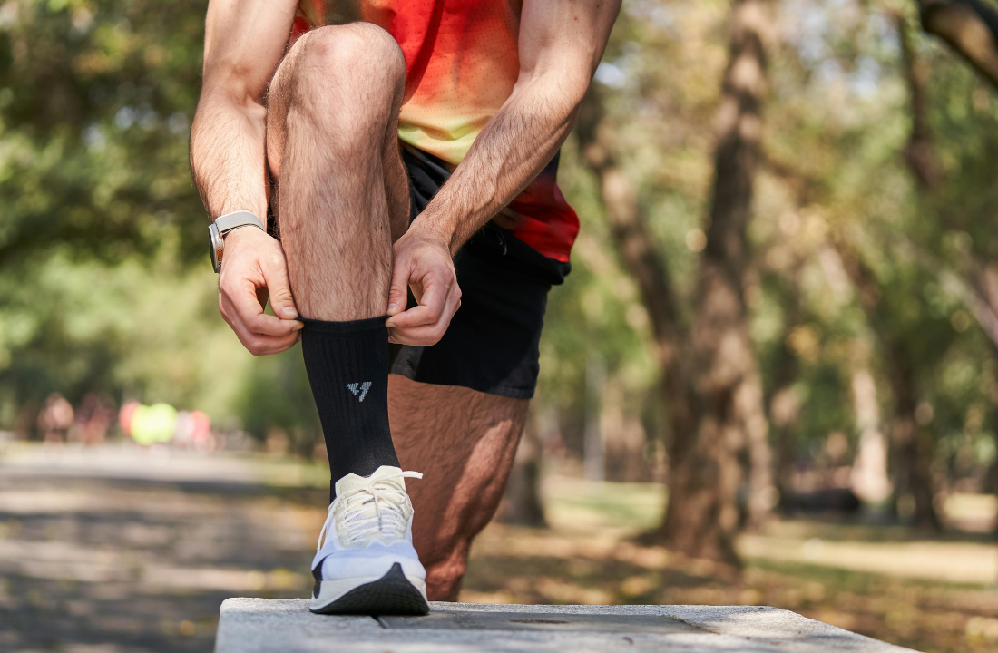 runner putting on two socks